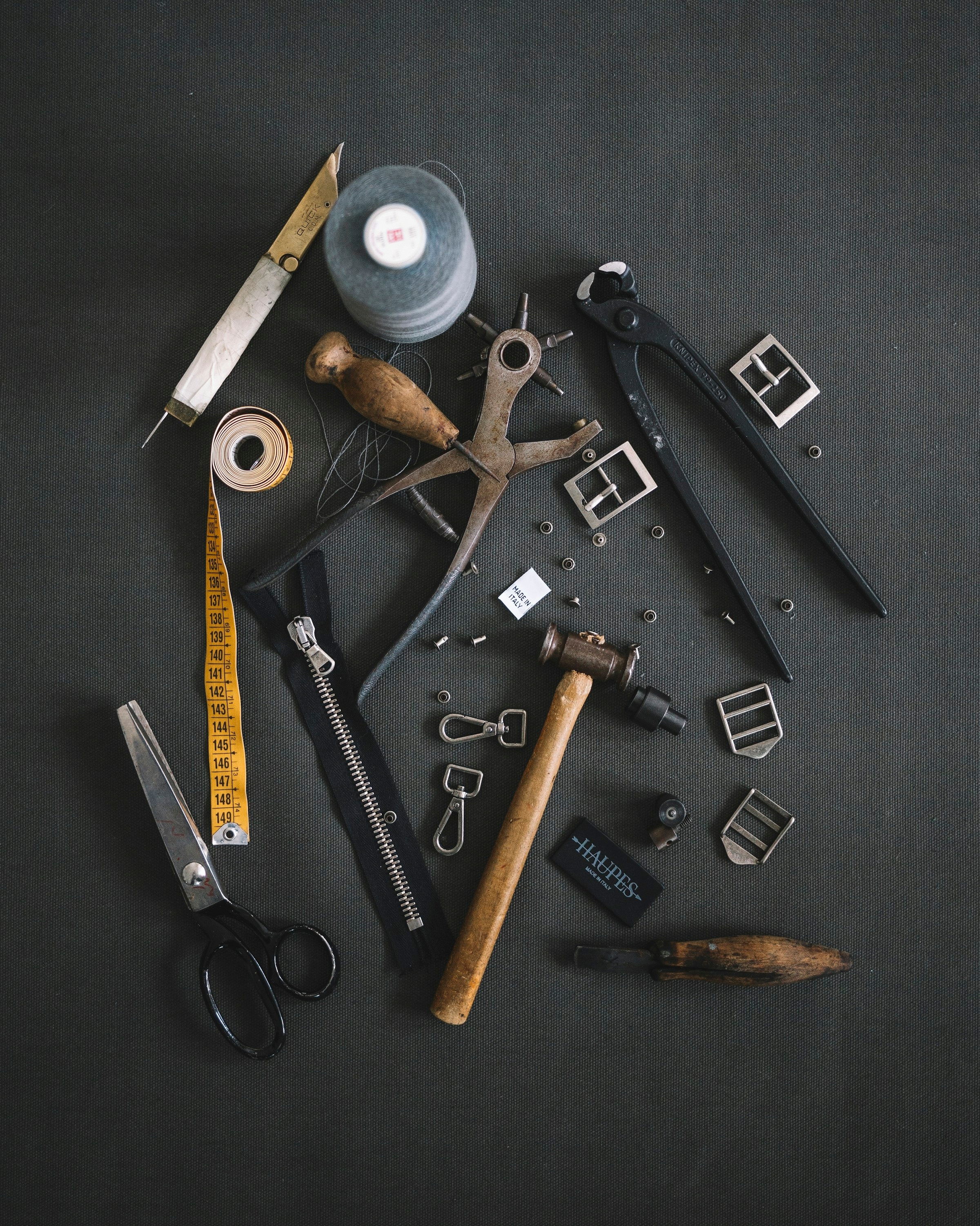Upholstery tools arranged for a sofa repair