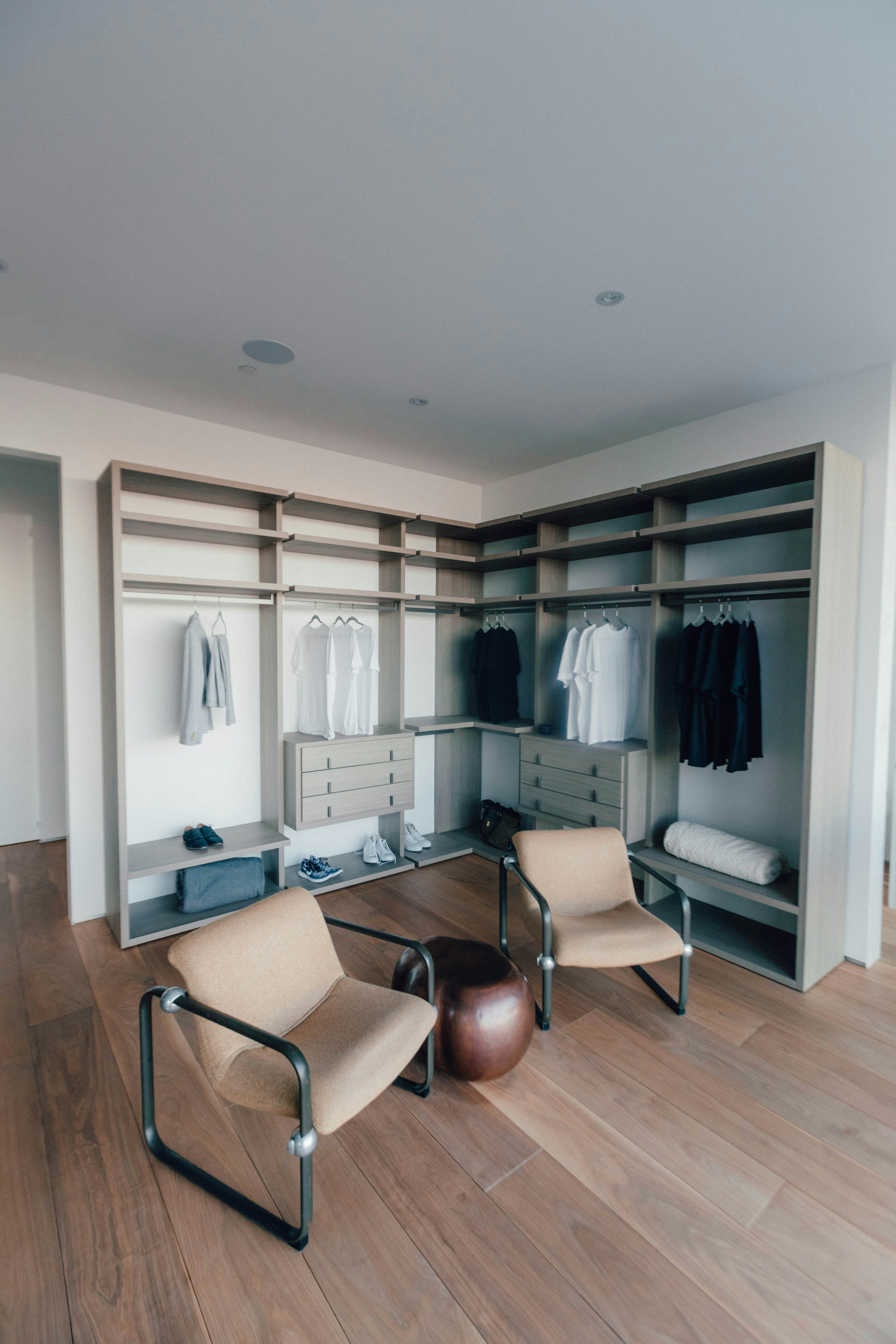 Fitted walk-in wardrobe with open shelving and hanging space