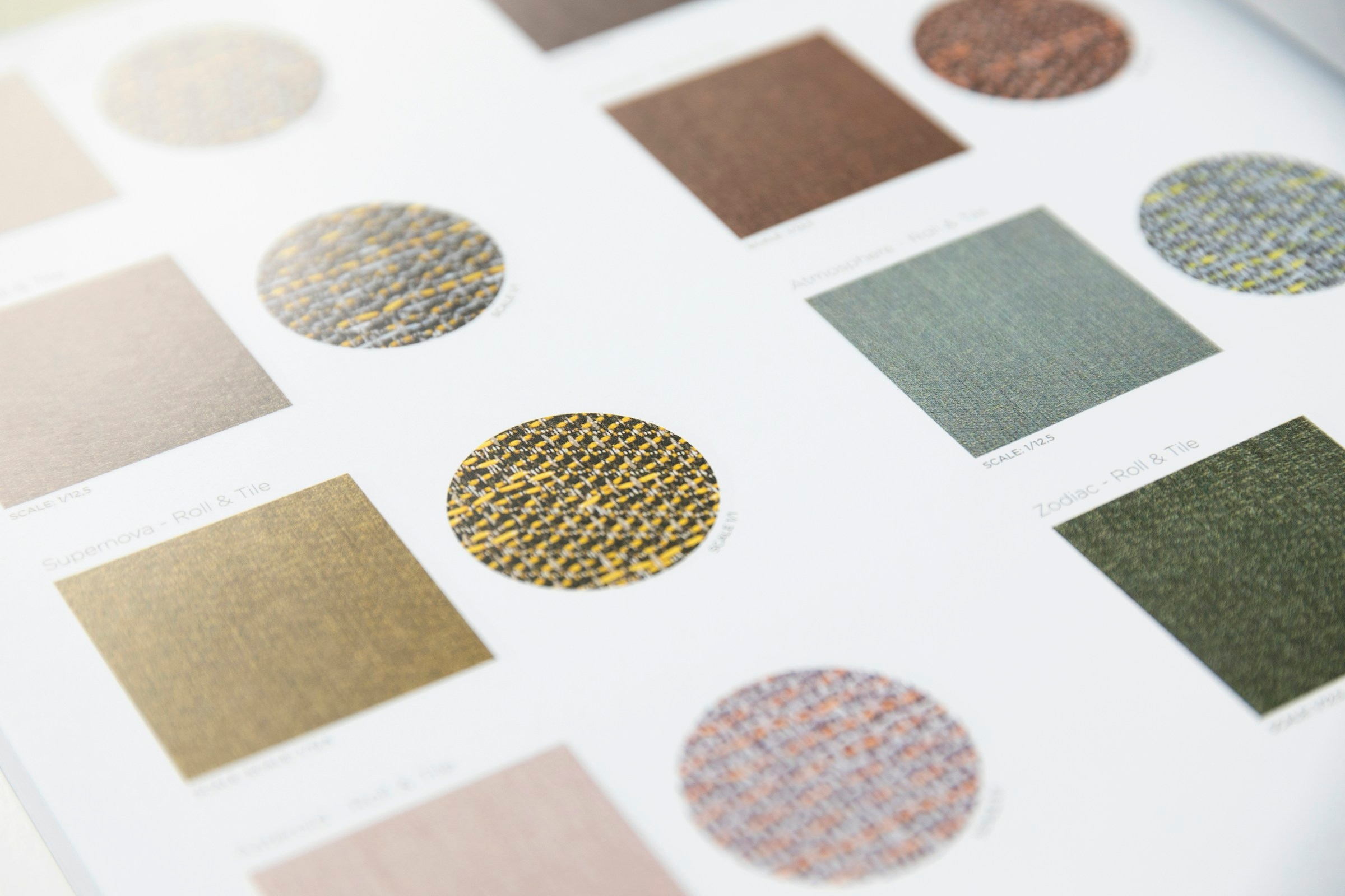 Upholstery fabric swatches laid out for a sofa order